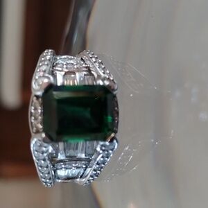 Emerald cut green jeweled bridge ring